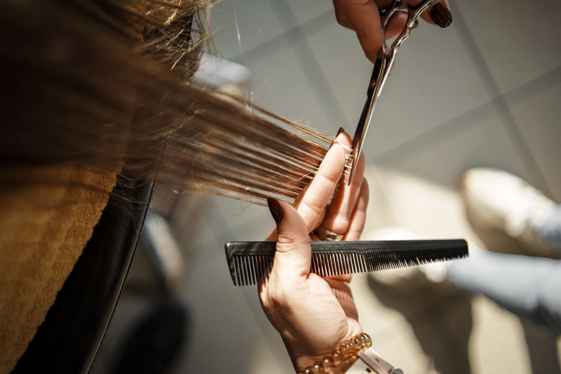 Scissor-over-comb work on mid-length hair